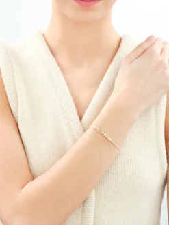 Bransoletka z cyrkoniami i elementami z żółtego złota - kulki