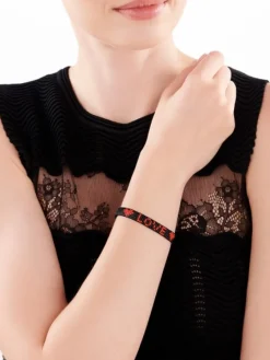 Bransoletka z elementami z żółtego złota i koralikami - serca, love