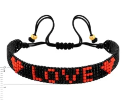 Bransoletka z elementami z żółtego złota i koralikami - serca, love