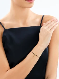 Bransoletka z elementami srebra - litera M, motyl