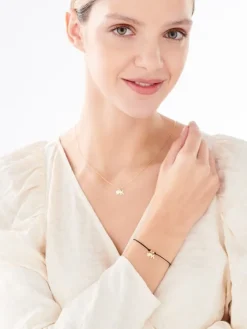 Bransoletka z elementami srebra - litera K, koniczyna