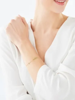 Bransoletka z żółtego i białego złota z brylantem - piórko - 0,005 ct - próba 375