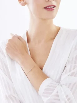 Bransoletka z żółtego złota z diamentami - skrzydło - 0,01 ct - próba 375