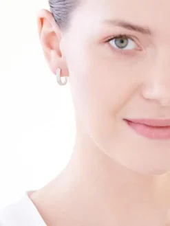 Kolczyki z białego złota z diamentami - koła - 0,16 ct - próba 585