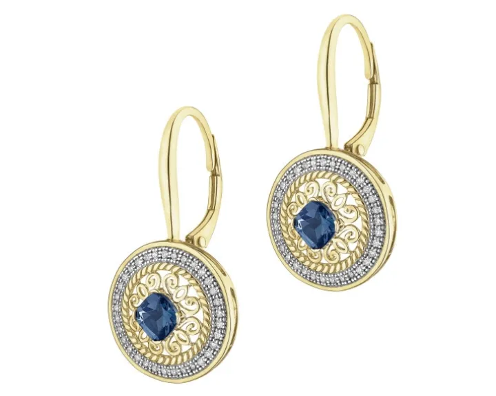 Kolczyki z żółtego złota z diamentami i topazami London Blue - rozeta - próba 585