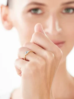 Pierścionek z żółtego złota z diamentami i topazem - próba 375