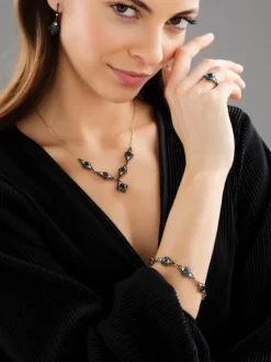 Pierścionek z żółtego złota z brylantami i topazem London Blue - próba 585