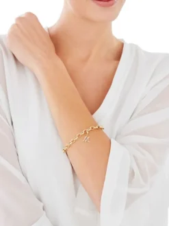 Zawieszka charms z żółtego złota z diamentem - litera M - 0,004 ct - próba 375