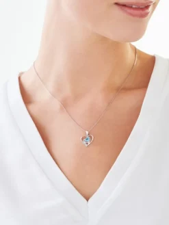 Zawieszka z białego złota z diamentem i topazem - serca - próba 375