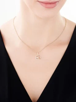 Zawieszka z żółtego złota z brylantami - serce, piesek - 0,03 ct - próba 375