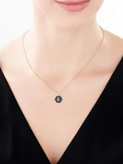 Zawieszka z żółtego złota z diamentem i onyksem - litera K - próba 375