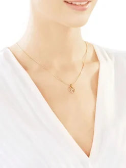 Zawieszka z żółtego złota z diamentami - serca - 0,004 ct - próba 585