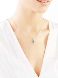 Zawieszka z żółtego złota z diamentami i topazem - próba 375