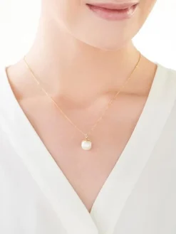 Zawieszka z żółtego złota z diamentami i perłą - próba 585