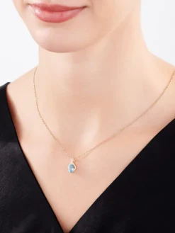 Zawieszka z żółtego złota z diamentami i topazem - próba 375