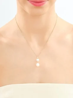 Zawieszka z żółtego złota z diamentami i perłami - próba 585