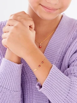 Złota bransoletka z emalią i blaszką - biedronki