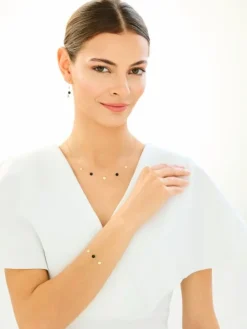 Złota bransoletka z onyksem syntetycznym - koła