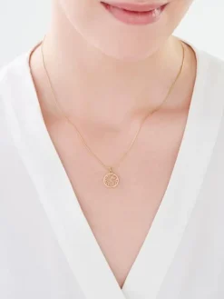 Złota zawieszka - kula ziemska