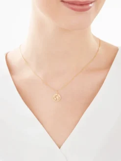 Złota zawieszka - kula ziemska