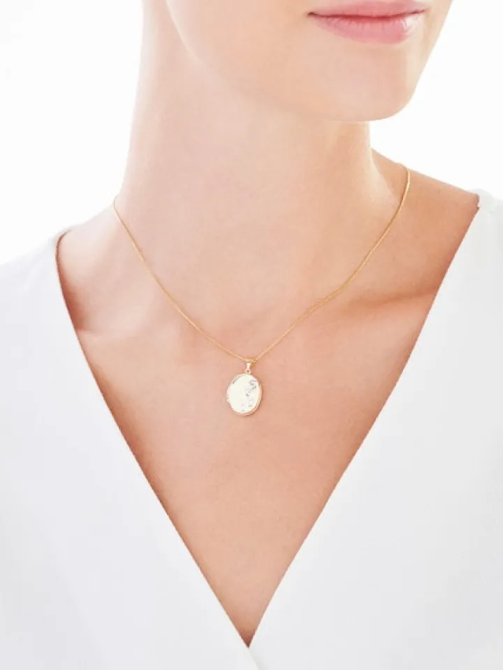 Złota zawieszka - puzderko - stópki