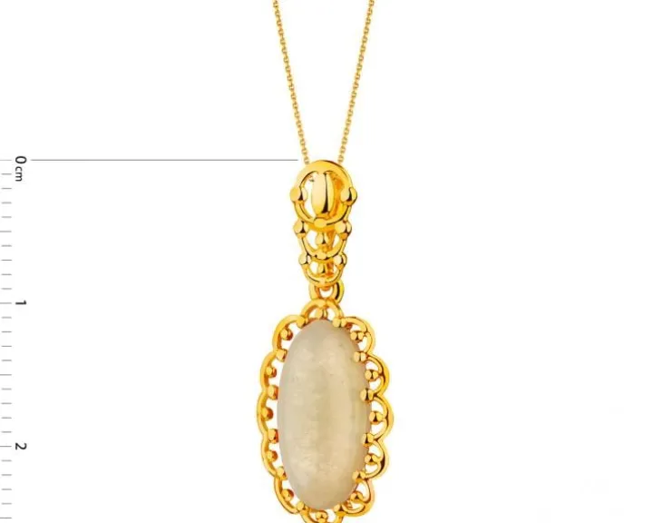 Złota zawieszka z bursztynem