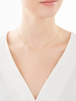 Złota zawieszka z cyrkonią