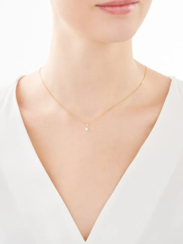 Złota zawieszka z cyrkonią