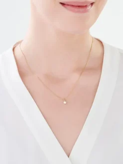 Złota zawieszka z cyrkonią