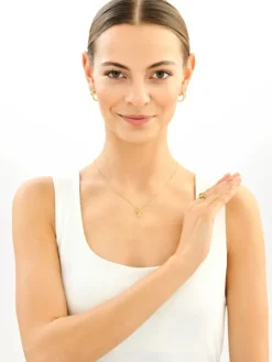 Złota zawieszka z cyrkonią