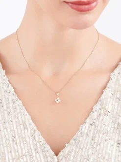 Złota zawieszka z cyrkonią i onyksem syntetycznym