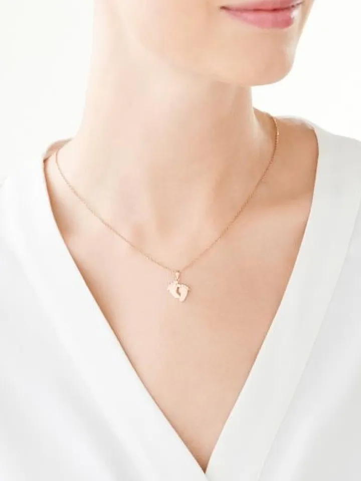 Złota zawieszka z cyrkonią - stópki