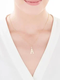 Złota zawieszka z cyrkonią - litera A