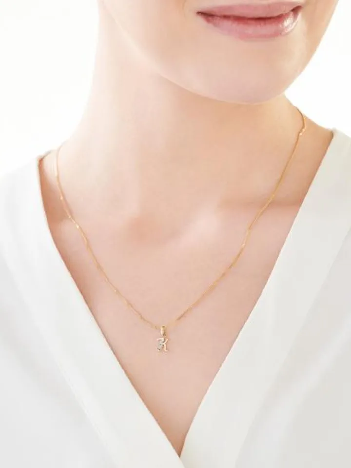 Złota zawieszka z cyrkonią - litera K