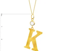 Złota zawieszka z cyrkonią - litera K