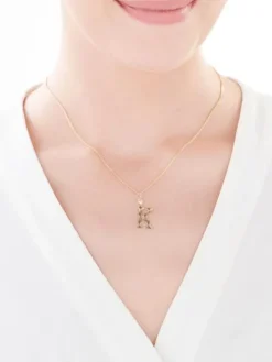 Złota zawieszka z cyrkonią - litera K