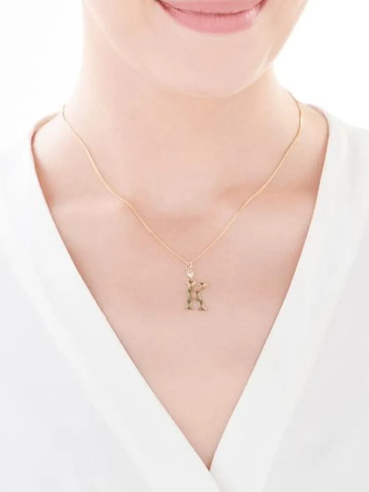 Złota zawieszka z cyrkonią - litera K