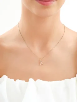 Złota zawieszka z cyrkoniami - litera K