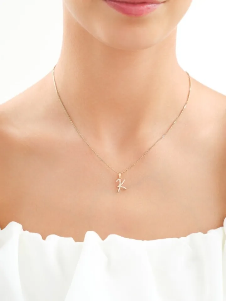 Złota zawieszka z cyrkoniami - litera K