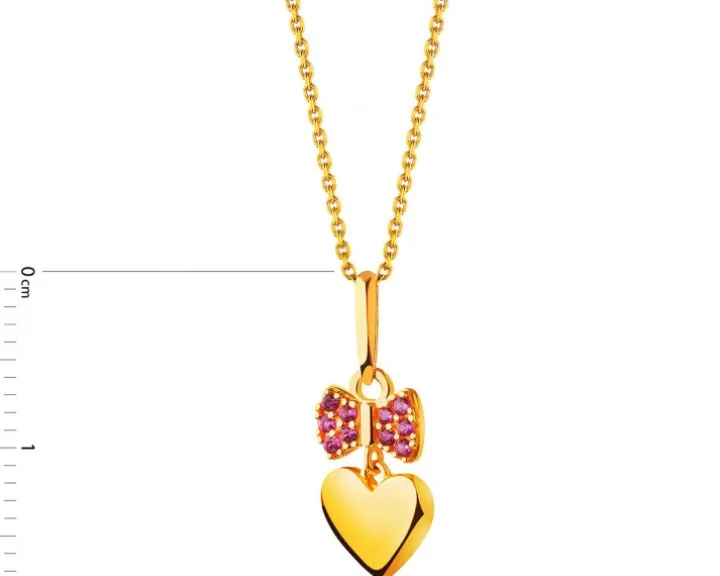 Złota zawieszka z cyrkoniami - serce, kokardka