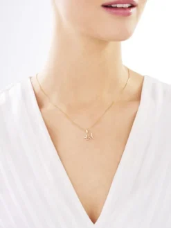 Złota zawieszka z cyrkoniami - litera M