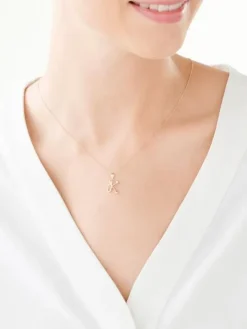 Złota zawieszka z cyrkoniami - litera K