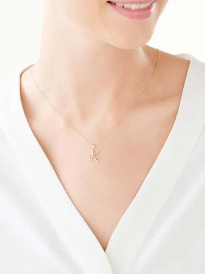 Złota zawieszka z cyrkoniami - litera K