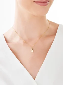 Złota zawieszka z cyrkoniami