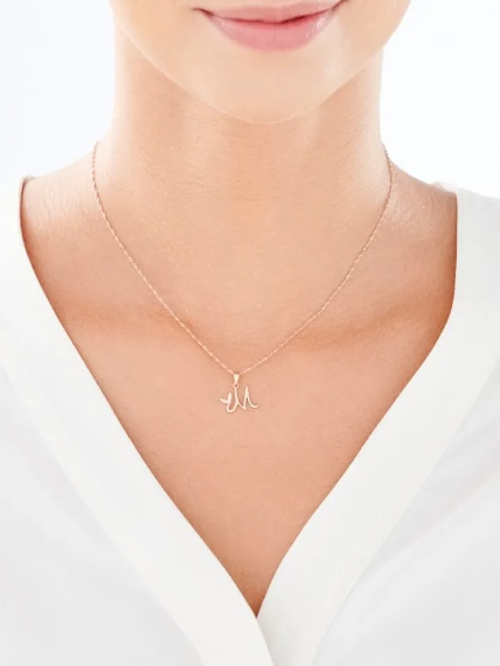 Złota zawieszka z cyrkoniami - litera M