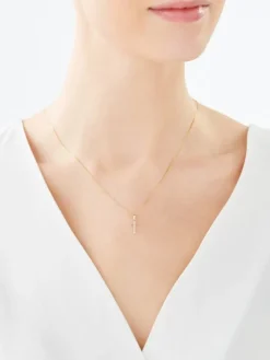 Złota zawieszka z cyrkoniami - krzyż