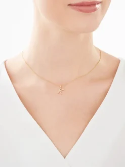 Złota zawieszka z cyrkoniami - litera K