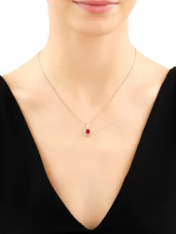 Złota zawieszka z korundem syntetycznym