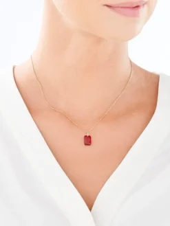 Złota zawieszka z kryształem syntetycznym