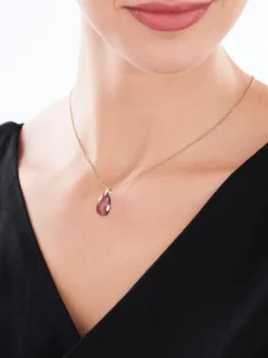 Złota zawieszka z kryształem syntetycznym